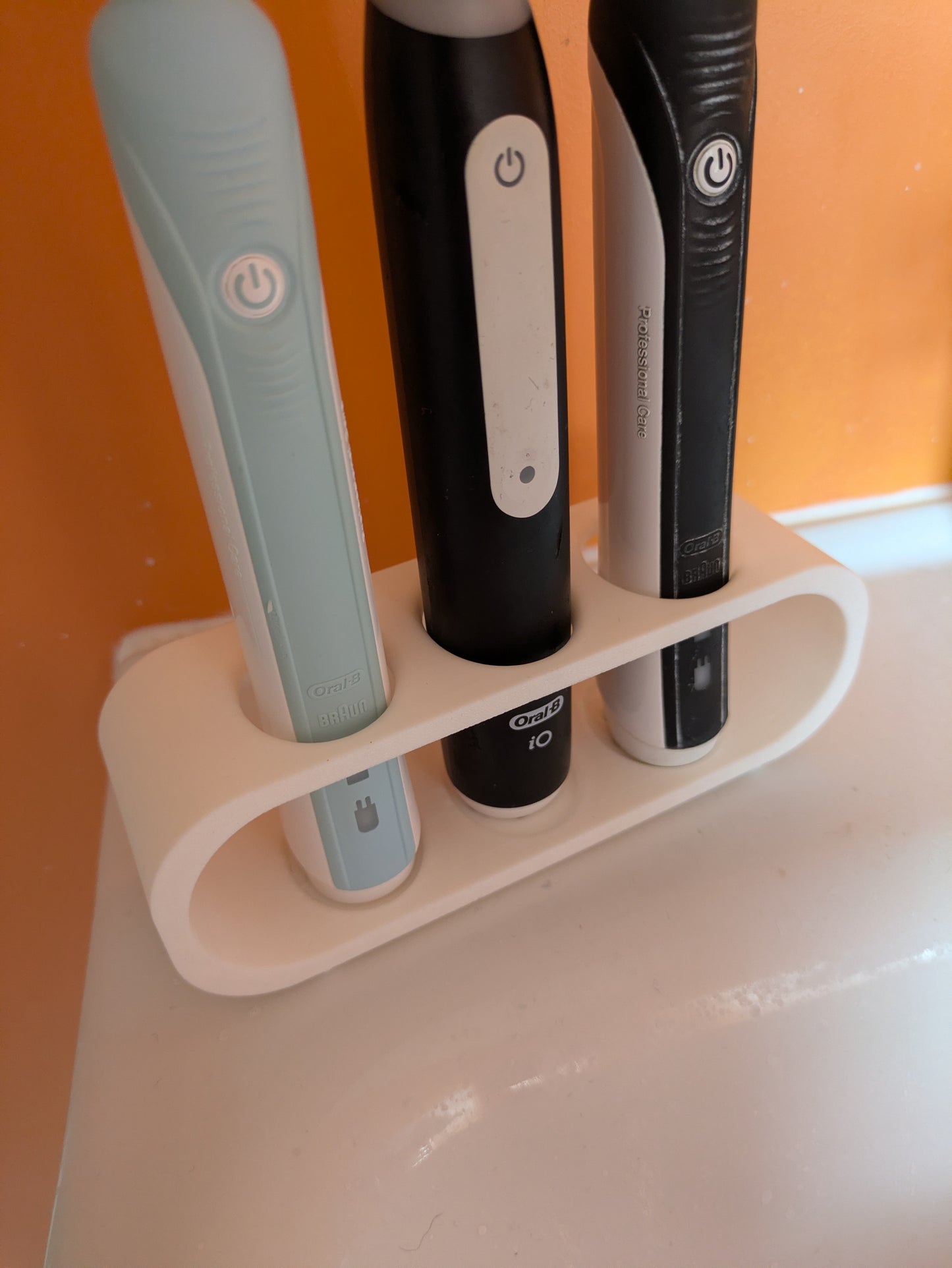 Toothbrush holder for 3 Oral B electric toothbrushes
