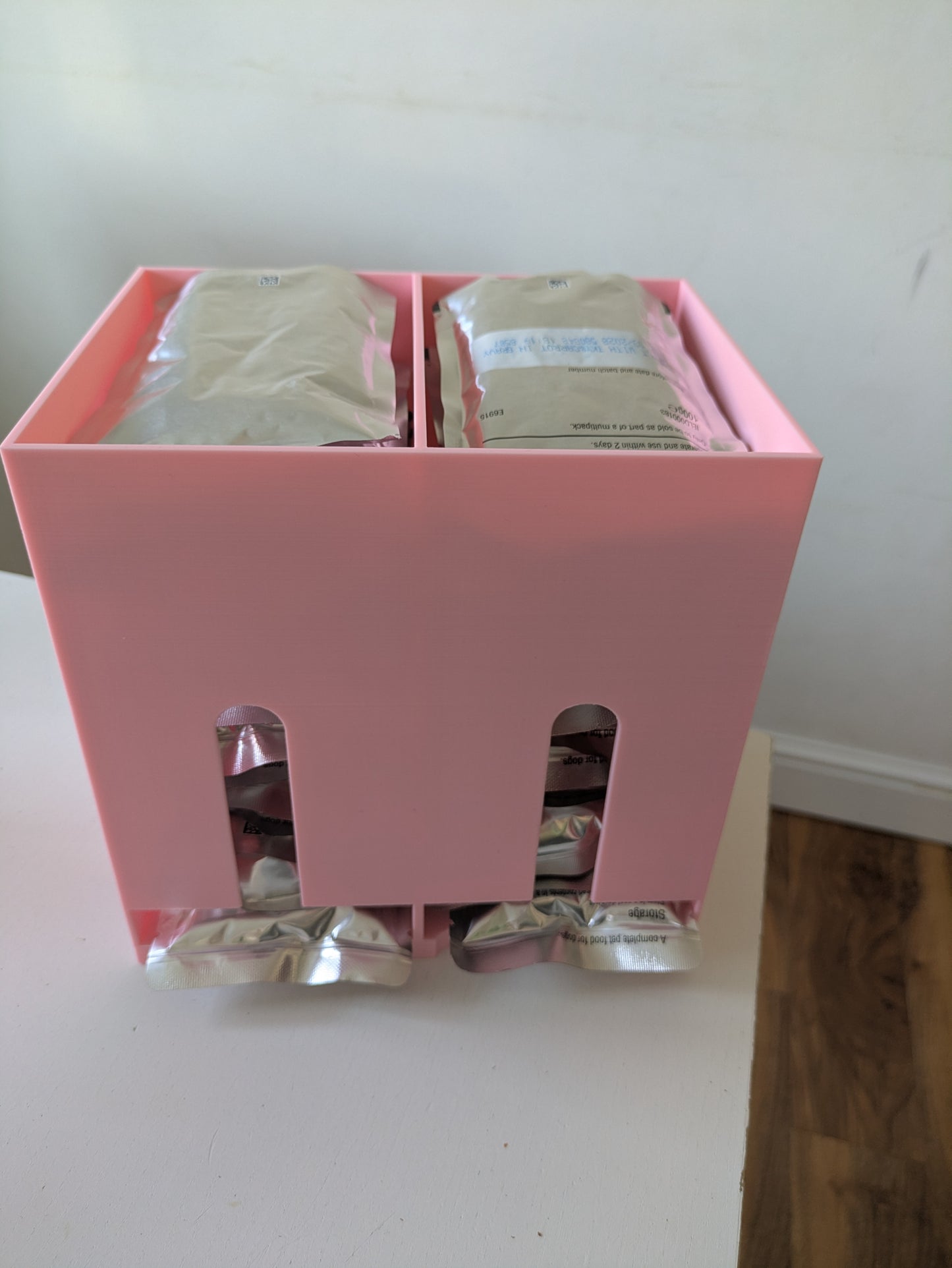 Double size pet food pouch holder & dispenser with paw prints on sides